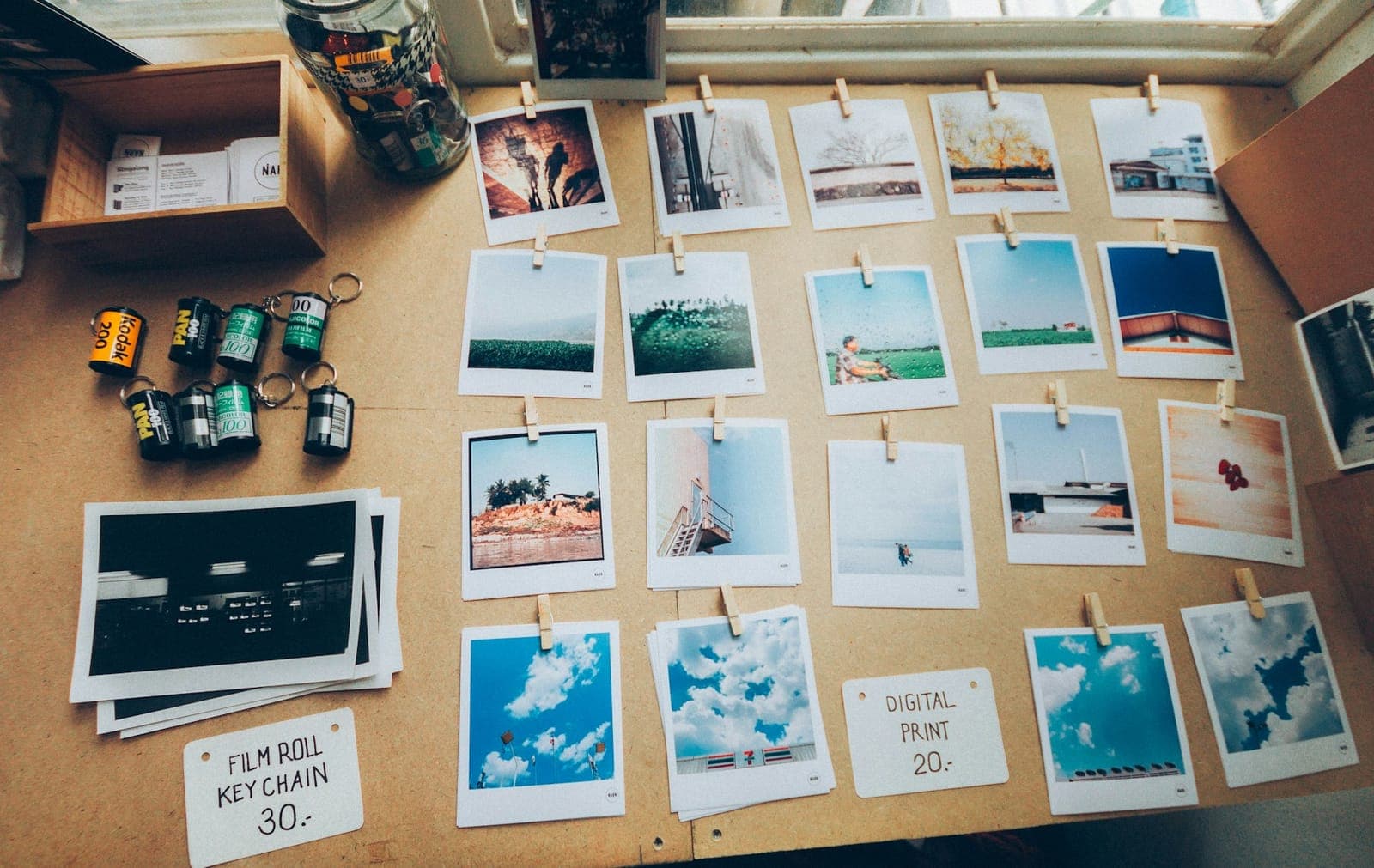 Polaroid prints pinned on a wooden board